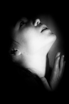 close up of a beautiful young woman looking upwards