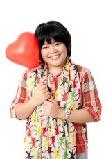 portrait of a mid adult female with heart shape balloon