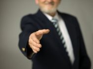 photo-24786479-businessman-offering-a-hand