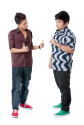 photo-24765824-two-young-men-having-a-conversation