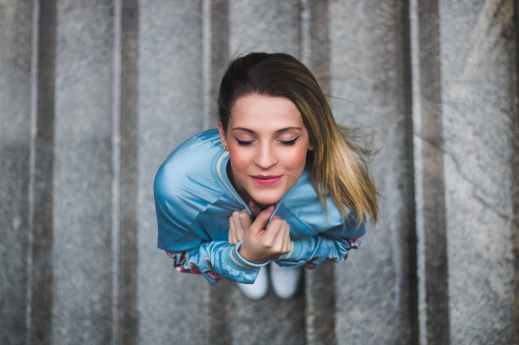 woman holding her jacket