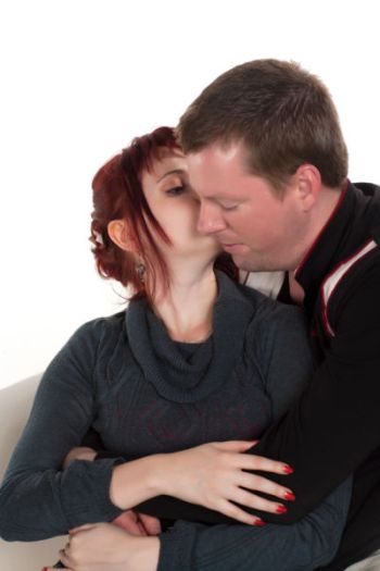 photo-24779825-woman-kissing-her-man-on-cheek